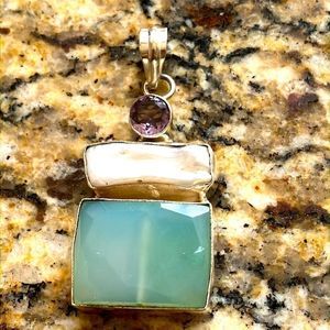 5/$25 Necklace Pendant with stones, not authentic.